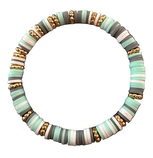 Beaded bracelet with gold accents on a gray background with measurement text